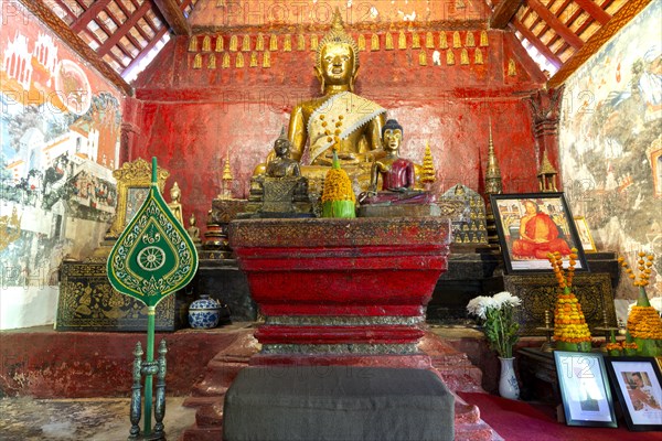 Golden Buddha statue, Bhumispara-mudra, Buddha Gautama at the moment of enlightenment, Wat Long Koon, Luang Prabang, Laos, Asia