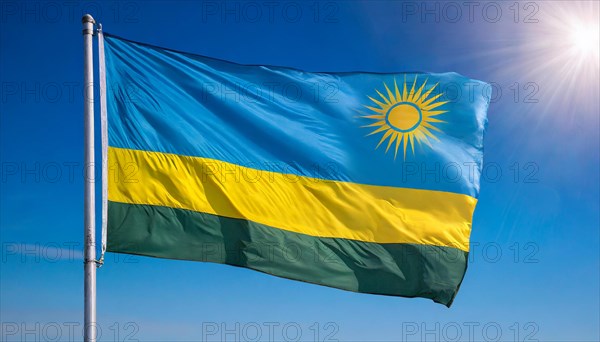 The flag of Rwanda, fluttering in the wind, isolated, against the blue sky