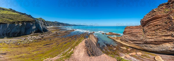 Panoramic view of the beautiful Algorri cove in the Flysch Basque Coast geopark in Zumaia, Gipuzkoa