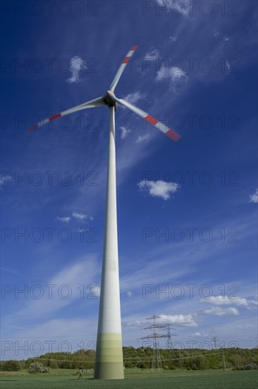 Wind turbine and high-voltage pylons near the Avacon substation Helmstedt, Helmstedt, Lower Saxony, Germany, Europe