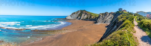 Panoramic of the Itzurun beach without people in the Flysch Basque Coast geopark in Zumaia, Gipuzkoa