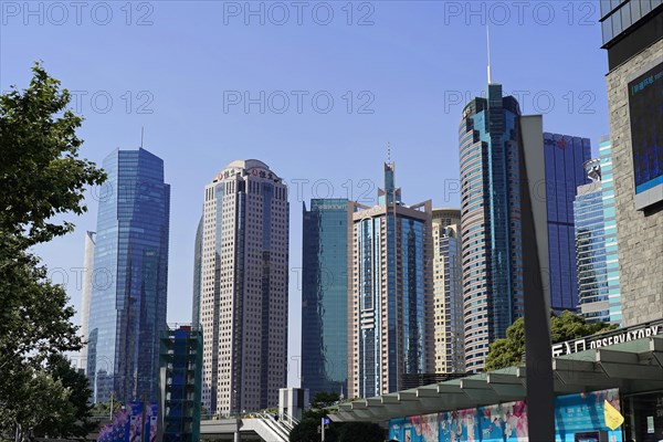 View of a skyline with various skyscrapers and modern architecture by day, Shanghai, China, Asia