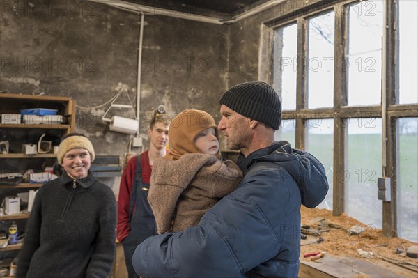 Family reunion in the workshop, father, daughter, son and grandson, Mecklenburg-Vorpommern, Germany, Europe