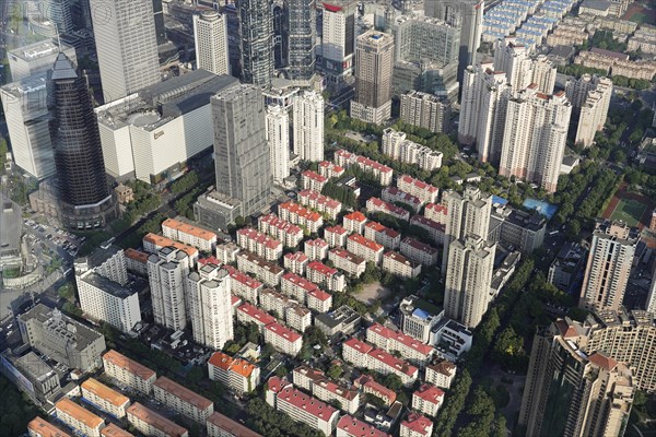 View from the 632 metre high Shanghai Tower, nicknamed The Twist, Shanghai, People's Republic of China, Densely built-up residential area with many apartment blocks and green spaces from a bird's eye view, Shanghai, China, Asia