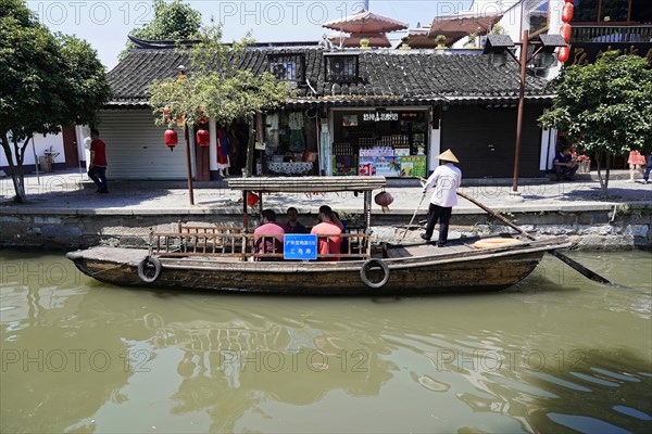 Excursion to the water village of Zhujiajiao, Shanghai, China, Asia, tourists on a boat trip along traditional city buildings, Asia