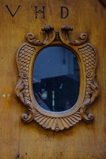 Historic wooden front door with window and inscription VHD in a heritage-protected building in the old town centre of Lindau (Lake Constance), Bavaria, Germany, Europe