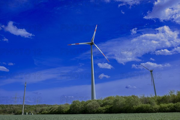 Power pylons with high-voltage lines, mobile phone mast and wind turbines at the Avacon substation Helmstedt, Helmstedt, Lower Saxony, Germany, Europe