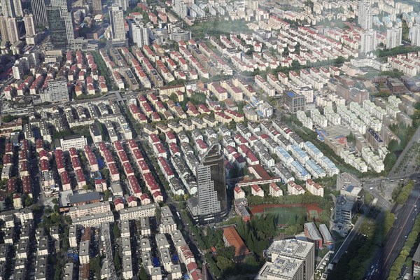 View from the 632 metre high Shanghai Tower, nicknamed The Twist, Shanghai, People's Republic of China, Orderly rows of apartment blocks interspersed with green trees, Shanghai, China, Asia