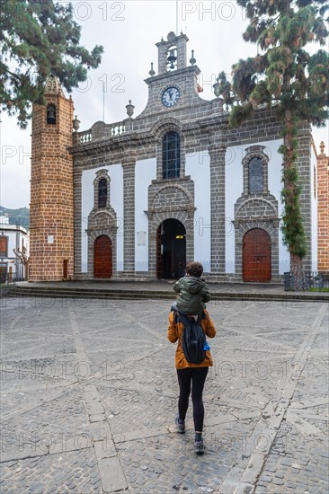 A mother with her son visiting the Basilica of Nuestra Senora del Pino in the municipality of Teror. Gran Canaria, Spain, Europe