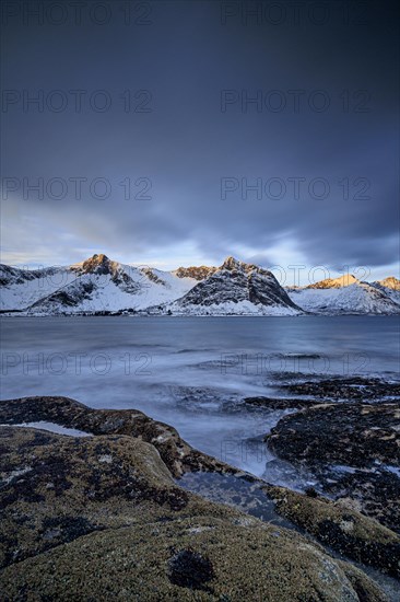 Rocky coast off Bergen, sea, waves, spray, morning mood with clouds, long exposure, winter, Tungeneset, Senja, Troms, Norway, Europe