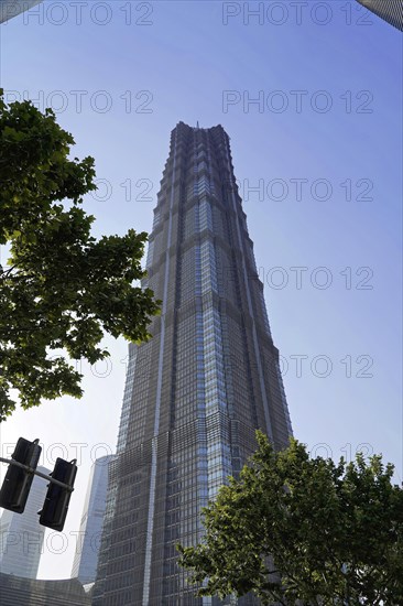 Jin Mao Tower, nicknamed The Syringe at 420 metres, futuristic skyscraper with pronounced geometric shapes under a blue sky, Shanghai, China, Asia