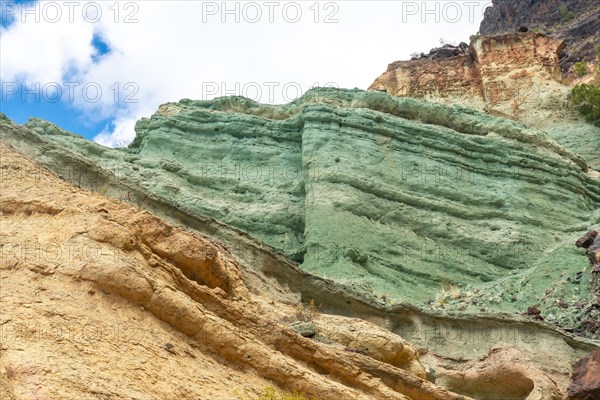 Detail of the colors in the Natural Monument Azulejos de Veneguera or Rainbow Rocks in Mogan, Gran Canaria