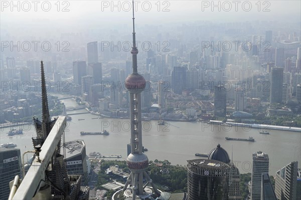 View from the 632 metre high Shanghai Tower, nicknamed The Twist, Shanghai, People's Republic of China, Urban view from above with skyscrapers rising out of a hazy atmosphere, Shanghai, China, Asia