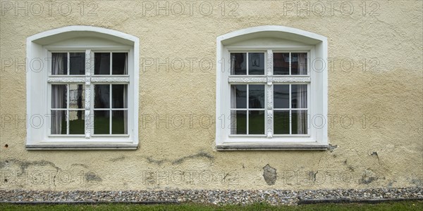 Symbolic image: Two windows in a house wall, using the example of St George's Monastery, now Isny Castle, in Isny im Allgaeu, Baden-Wuerttemberg, Germany, Europe