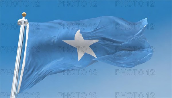 The flag of Somalia, fluttering in the wind, isolated, against the blue sky