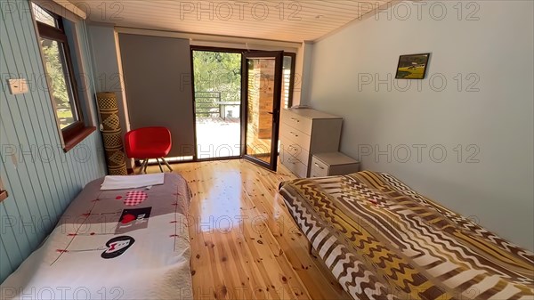 Interior of a hotel room with a double bed. Nobody inside