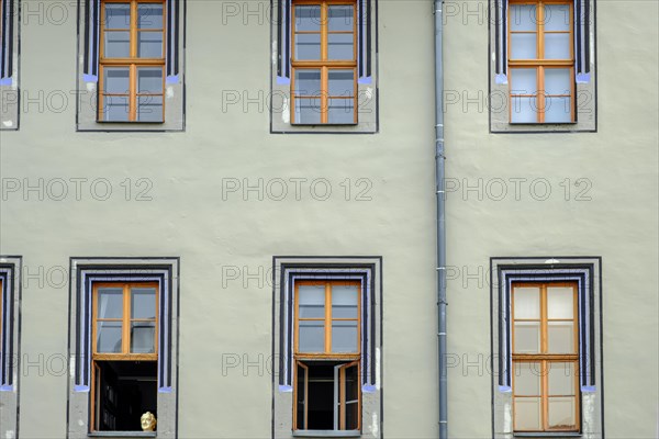 The bust of Johann Wolfgang von Goethe in the lower left window in rows of windows of the Red Palace, a Renaissance building in Weimar, Thuringia, Germany, Europe
