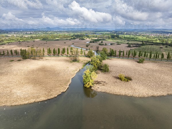 Aerial view of the Radolfzeller Aach, which flows into western Lake Constance surrounded by a belt of reeds, behind it the Raolfzeller Aachried, on the horizon the Hegauberge, district of Constance, Baden-Wuerttemberg, Germany, Europe