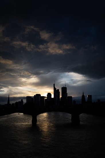 Dense clouds pass over the Frankfurt banking skyline in the evening, Floesserbruecke, Frankfurt am Main, Hesse, Germany, Europe