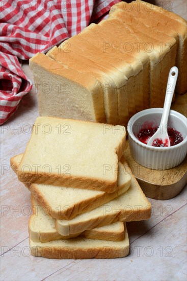 Toast, slices of toast and bowls of jam