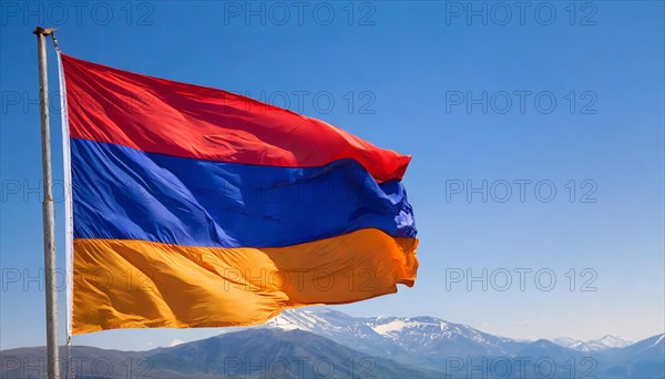 The flag of Armenia flutters in the wind, isolated against a blue sky