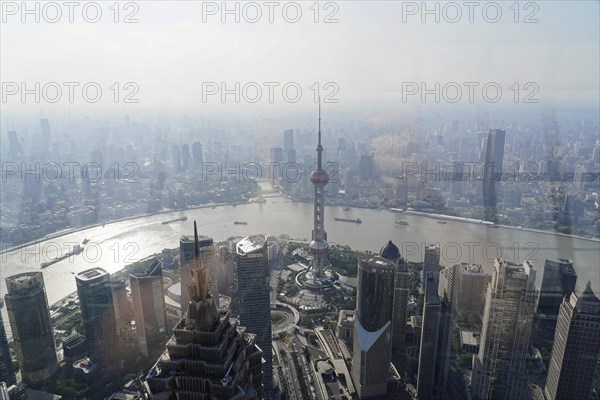 View from the 632 metre high Shanghai Tower, nicknamed The Twist, Shanghai, People's Republic of China, panoramic view of urban skyscrapers and a river from the viewpoint, Shanghai, China, Asia