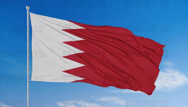 The flag of Bahrain flutters in the wind, isolated against a blue sky