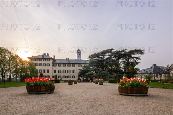 A castle with park at sunset. Historic building. Summer residence of the Prussian kings and German emperors in Bad Homburg, Hesse, Germany, Europe