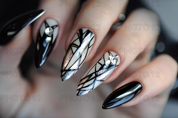 Woman's fingernails with long stiletto shaped nails with black and white nail art deisgn. KI generiert, generiert, AI generated