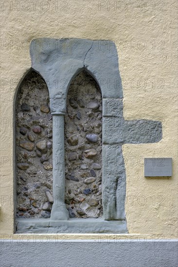 Gothic bifore window with Romanesque cube capital in the medieval hospital building in Lindau (Lake Constance), Bavaria, Germany, Europe
