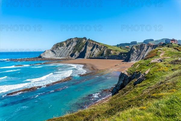 Beautiful Itzurun beach from Cala de Algorri in the Flysch Basque Coast geopark in Zumaia, Gipuzkoa