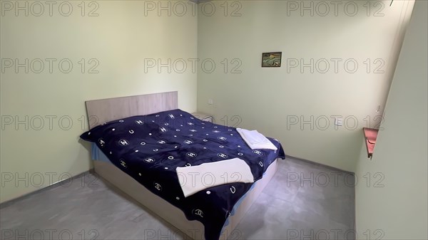 Interior of a bedroom in a new house with a double bed