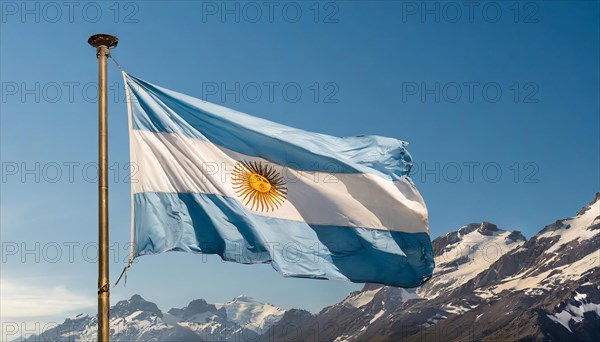 The flag of Argentina flutters in the wind, isolated against a blue sky