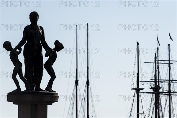 Sculptures by Gustav Vigeland and ship masts, City Hall forecourt, Oslo, Norway, Europe