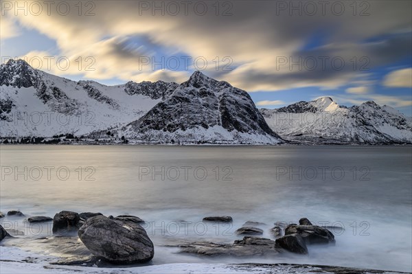 Rocky coast off Bergen, sea, waves, spray, morning mood with clouds, long exposure, winter, Tungeneset, Senja, Troms, Norway, Europe