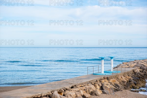 Showers on the beach in Sitges, Spain, Europe