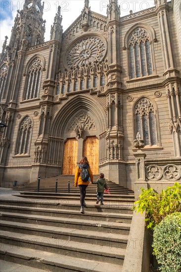 A mother with her son visiting the Church of San Juan Bautista, Arucas Cathedral, Gran Canaria, Spain, Europe