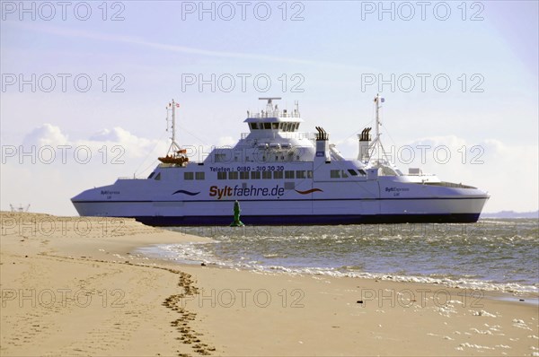 Sylt, Schleswig-Holstein, The Sylt ferry in the sea near a beach under a blue sky, Sylt, North Frisian Island, Schleswig-Holstein, Germany, Europe