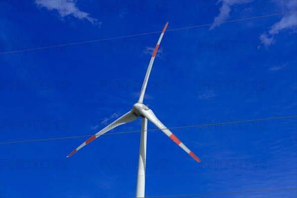 Wind turbine and high-voltage lines at the Avacon substation in Helmstedt, Helmstedt, Lower Saxony, Germany, Europe