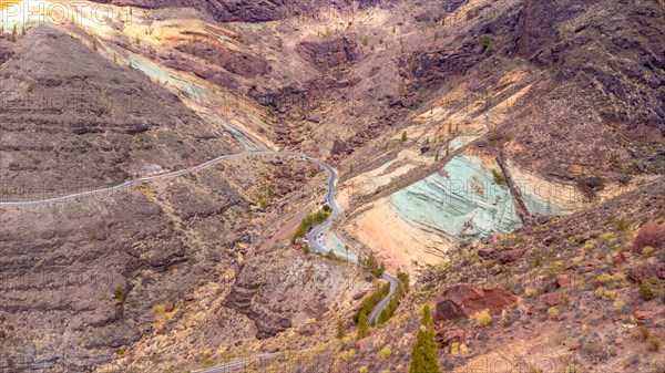 Aerial view of the Azulejos de Veneguera or Rainbow Rocks Natural Monument in Mogan, Gran Canaria