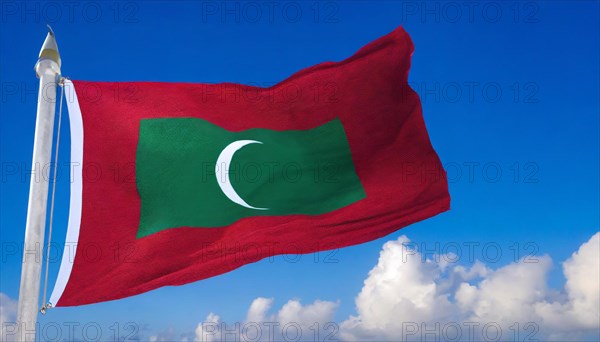 The flag of Maldives, fluttering in the wind, isolated, against the blue sky