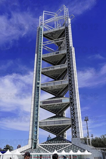 Beijing, China, Asia, Modern tower with metallic scaffolding structure in front of a deep blue sky, Asia