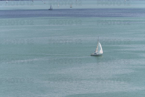 Sailing boat on the turquoise waters of Lake Constance, near Meersburg, Baden-Wuerttemberg, Germany, Europe