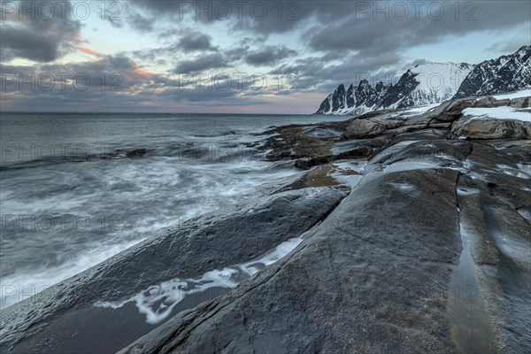 Rocky coast off Bergen, sea, spray, waves, morning mood with clouds, winter, Tungeneset, Senja, Troms, Norway, Europe