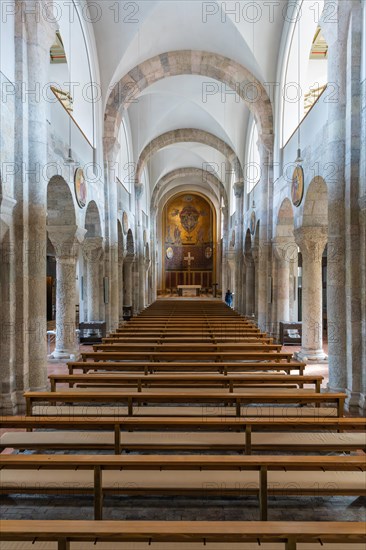 Interior of a church with stone benches and columns, flooded with natural light, Bad Reichenhall, Bavaria, Germany, Europe