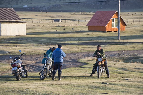 Mongolian men on motorbikes, Amarbayasgalant Monastery, Selenge Aimak, Selenge Province, Mongolia, Asia