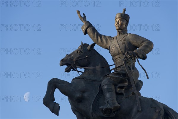 Crescent moon behind statue of Damdin Suekhbaatar on Genghis Khan Square or Suekhbaatar Square in the capital Ulaanbaatar, Ulan Bator, Mongolia, Asia