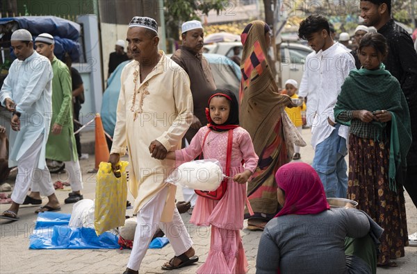 GUWAHATI, INDIA, APRIL 11: Muslim people with children walk towards an Eidgah to perform Eid Al-Fitr prayer in Guwahati, India on April 11, 2024. Muslims around the world are celebrating the Eid al-Fitr holiday, which marks the end of the fasting month of Ramadan