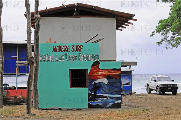 San Juan del Sur, Nicaragua, Colourful surf school with mural on the beach and parked car, Central America, Central America -, Central America