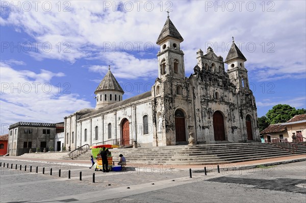 Church Iglesia de Guadalupe, built 1624 -1626, Granada, Older church building with two towers and a large forecourt under a cloudy sky, Nicaragua, Central America, Central America